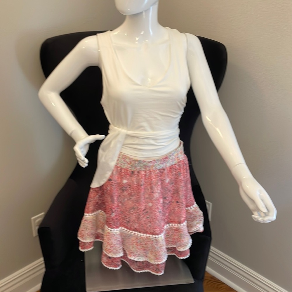 Brand new pink flouncy skirt; 100% polyester, medium; 17 inches from waist